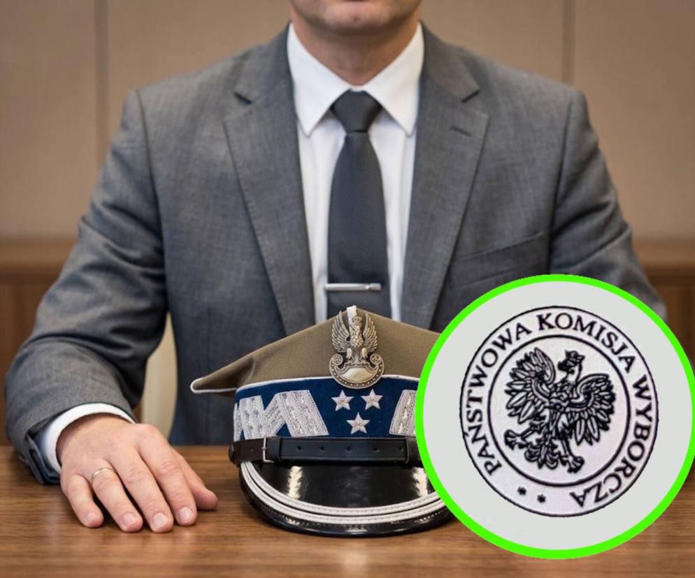 Mężczyzna w garniturze z czapką wojskową na biurku i logo PKW obok. O polityce wojskowych na SE Portal Obronny.