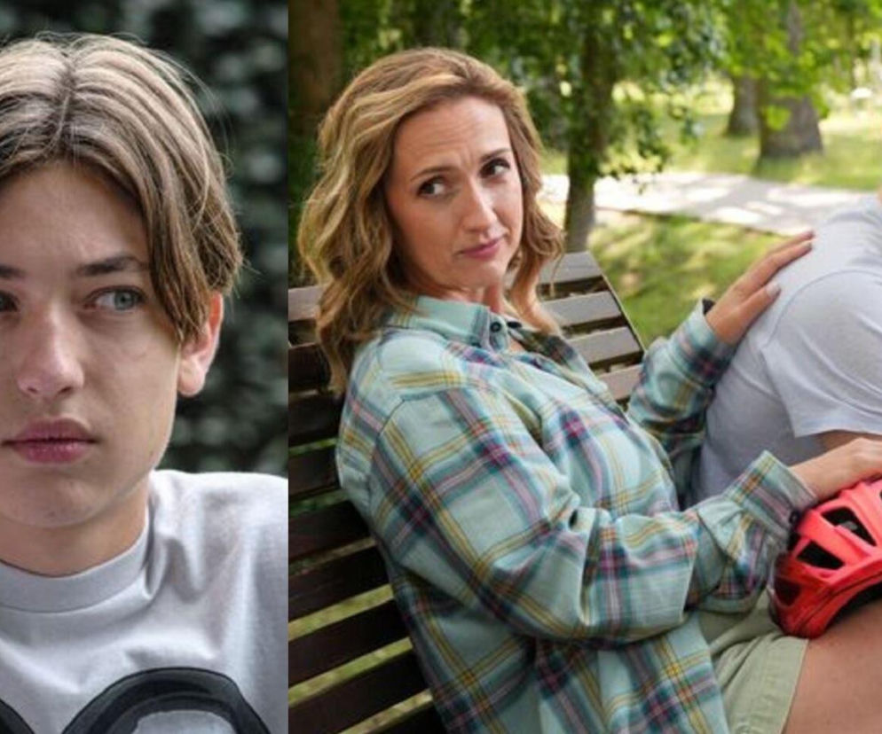 Emil (Artem Malaszczuk) z zasmuconą miną po lewej stronie, po prawej Asia (Anna Gzyra-Augustynowicz) opierająca rękę na ramieniu Huberta (Marek Molak), z czerwoną opaską sportową na udzie. W tle park. Scena z serialu Barwy szczęścia dostępna na portalu Super Seriale.