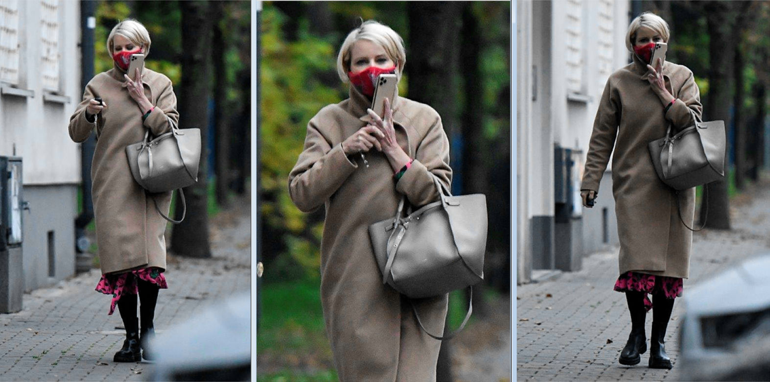 Wystrojona Kożuchowska rozmawia w masce przez telefon