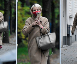 Wystrojona Kożuchowska rozmawia w masce przez telefon