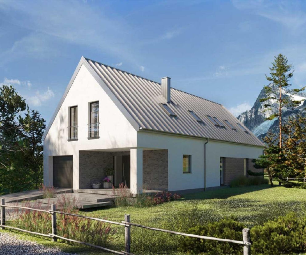 Nowoczesny dom typu stodoła z dwuspadowym dachem na tle gór. O projektach sudeckich przeczytasz na Muratordom.