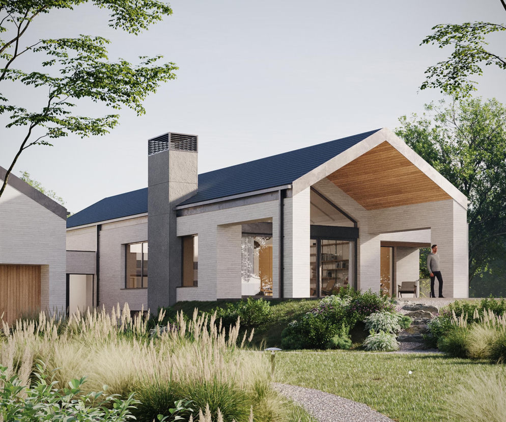 W centrum domu umieścili... komin. Dwie bryły scalił lekki szklany łącznik