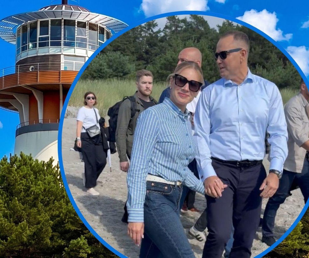 Karol i Marta Nawroccy na plaży w Juracie. W tle wieża rezydencji. O wizycie pary prezydenckiej przeczytasz w Eska.