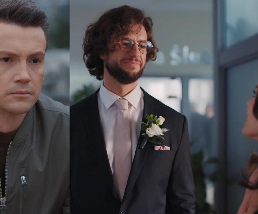 Jakub (Krzysztof Kwiatkowski) z serialu „M jak miłość” w ciemnej kurtce, z poważną miną, obok Mariusza (Mateusz Mosiewicz) w eleganckim garniturze ślubnym z krawatem i butonierką z kwiatów, z delikatnym uśmiechem, patrzący na Kasię (Paulina Lasota) w jasnej sukni. Więcej o dramacie Jakuba w dniu ślubu Kasi i Mariusza znajdziesz na Super Seriale.