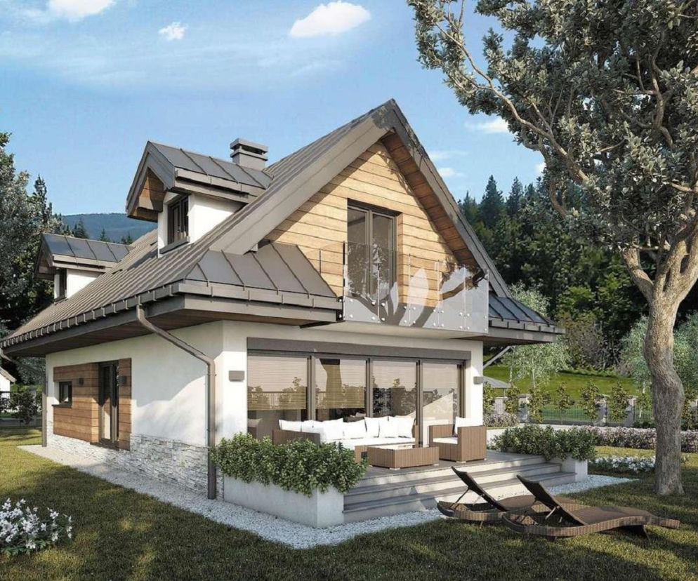 Dom Koliba New w stylu karpackim z tarasem i meblami ogrodowymi. O projektach domów marzeń przeczytasz na Muratordom.