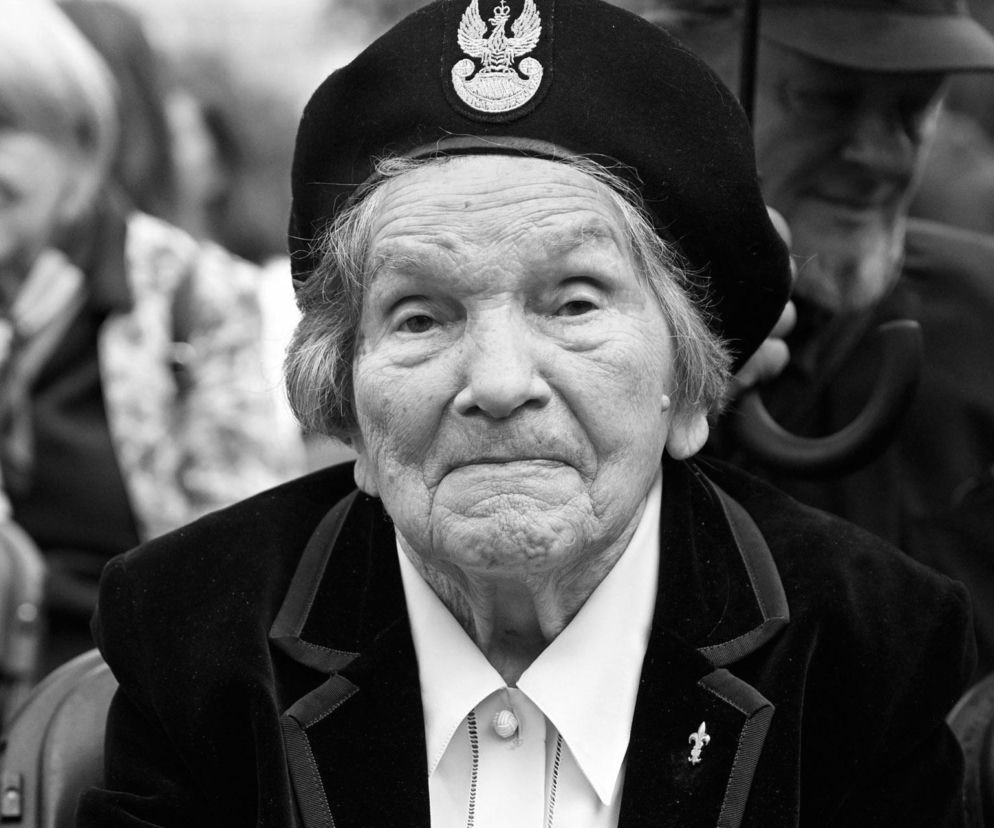 Portret Wandy Traczyk-Stawskiej w czarnym berecie z orzełkiem. O śmierci bohaterki powstania pisze SE.