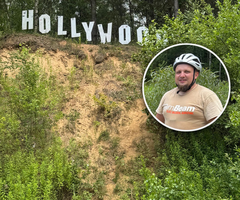 Biały napis Hollywood na wzgórzu w Szastarce. Na miniaturze uśmiechnięty rowerzysta. O atrakcji czytaj w Eska Lublin.