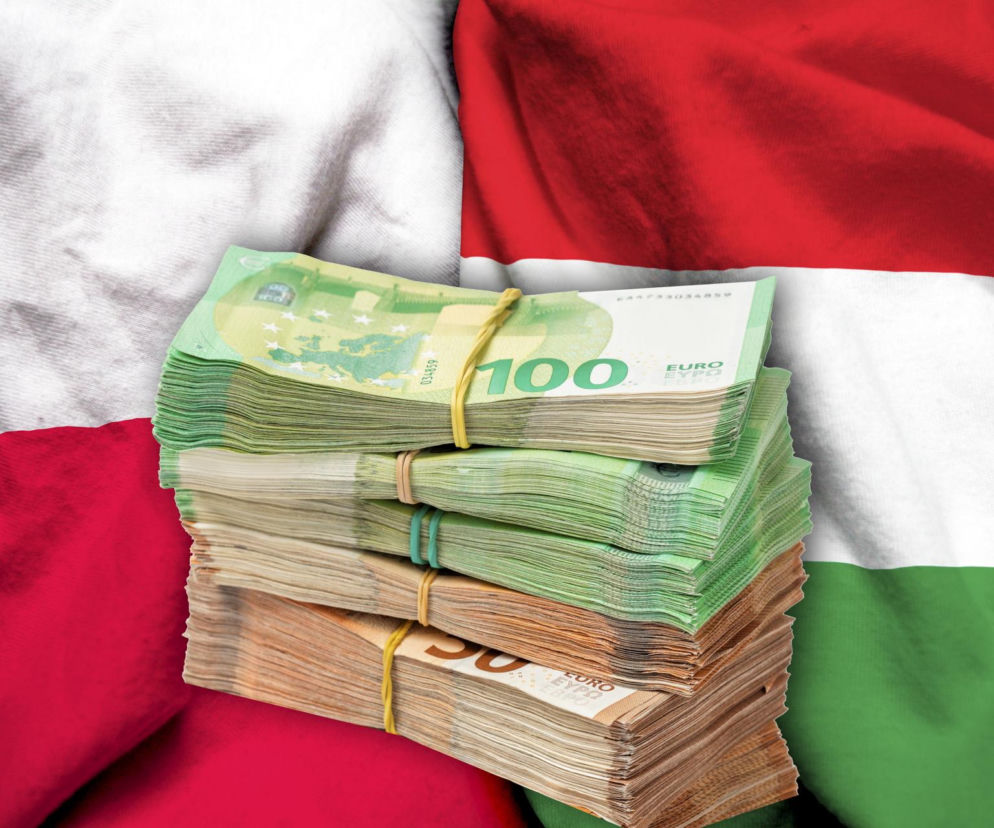 Stosy banknotów euro na tle falującej flagi Węgier symbolizują finansowanie KPO. Zdjęcie ilustruje wyzwania Węgier w dostępie do unijnych funduszy. Więcej o wpływie polityki na budżet krajów UE przeczytasz na portalu Super Biznes.